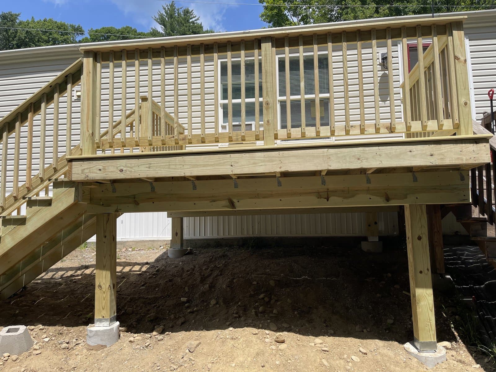 New deck with stairs and railings built by Morrison Handyman Services in New Hampshire